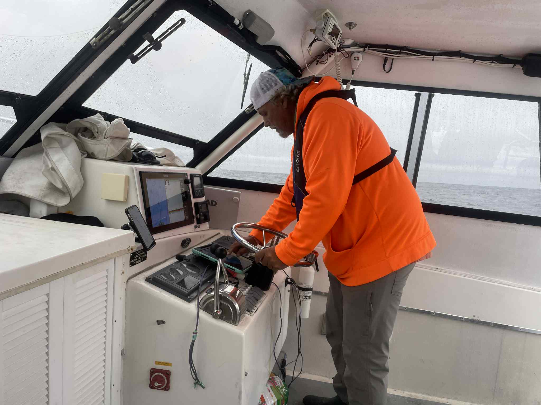 Captain at the helm of the Pescador on foggy day