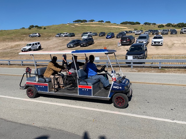 Wheelchair-accessible shuttle transporting veteran at Laguna Seca