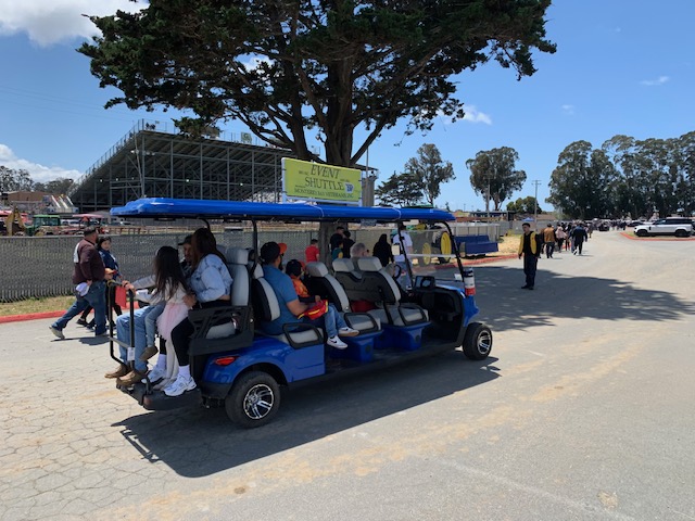 Blue MBV event shuttle picking up passengers